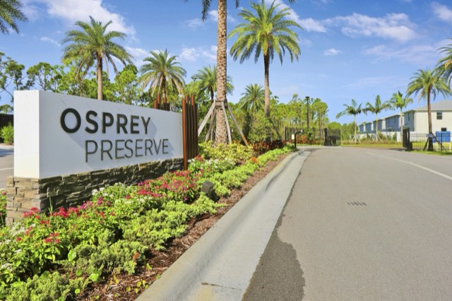 Osprey Preserve entrance sign from the other side, the entry road at the right