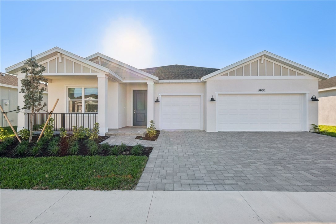 5680 Hampton Park Circle, real exterior photograph of a new-construction home in Vero Beach, Florida.