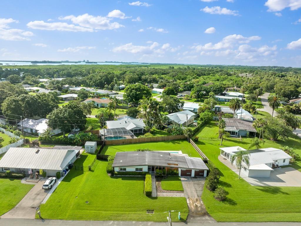 Backyard oblique with Indian River Lagoon visible in distance